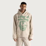 Better At Minding My Own Hoodie Taupe worn by model