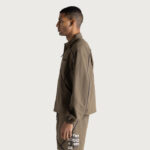 Growth Track Jacket Pebble back graphic on model